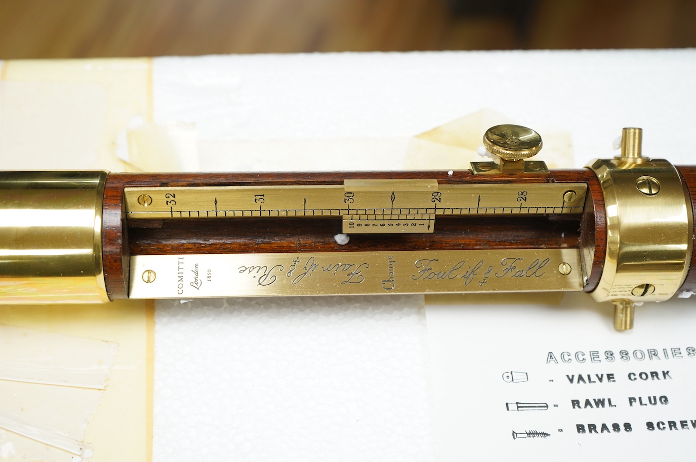 A reproduction Comitti marine stick barometer, 94cm, with glass tube not fitted but present, and missing gimbal mounting. Condition - good.